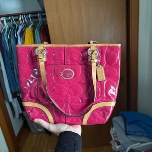 Coach Peyton embossed patent leather tote bag in magenta with tan trim